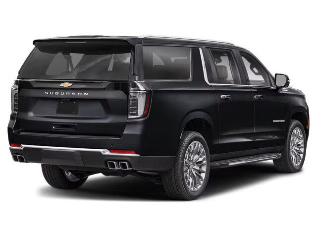 Black Chevrolet Suburban, rear three-quarter view