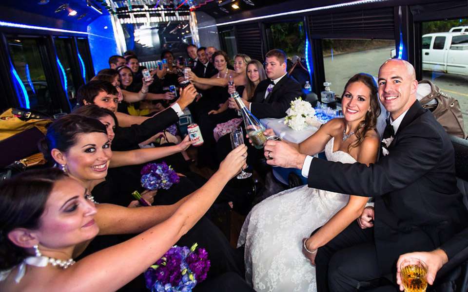 Wedding Party inside limo Bus