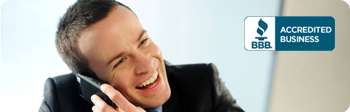 Smiling man on the phone beside a BBB Accredited Business logo