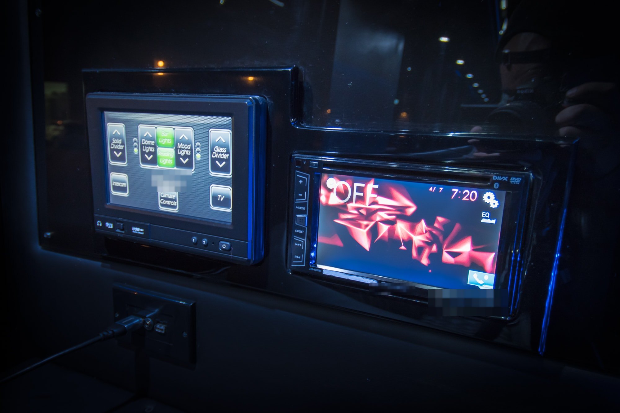 Touch panel for dome lights, mood lights and dividers beside a stereo screen