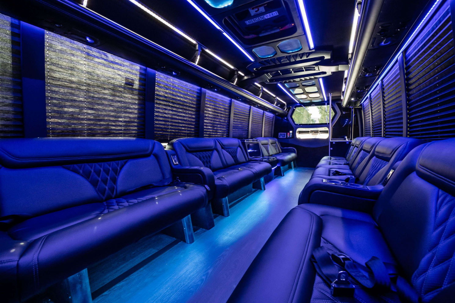 Party bus interior with blue LED lighting, black leather seats and window blinds